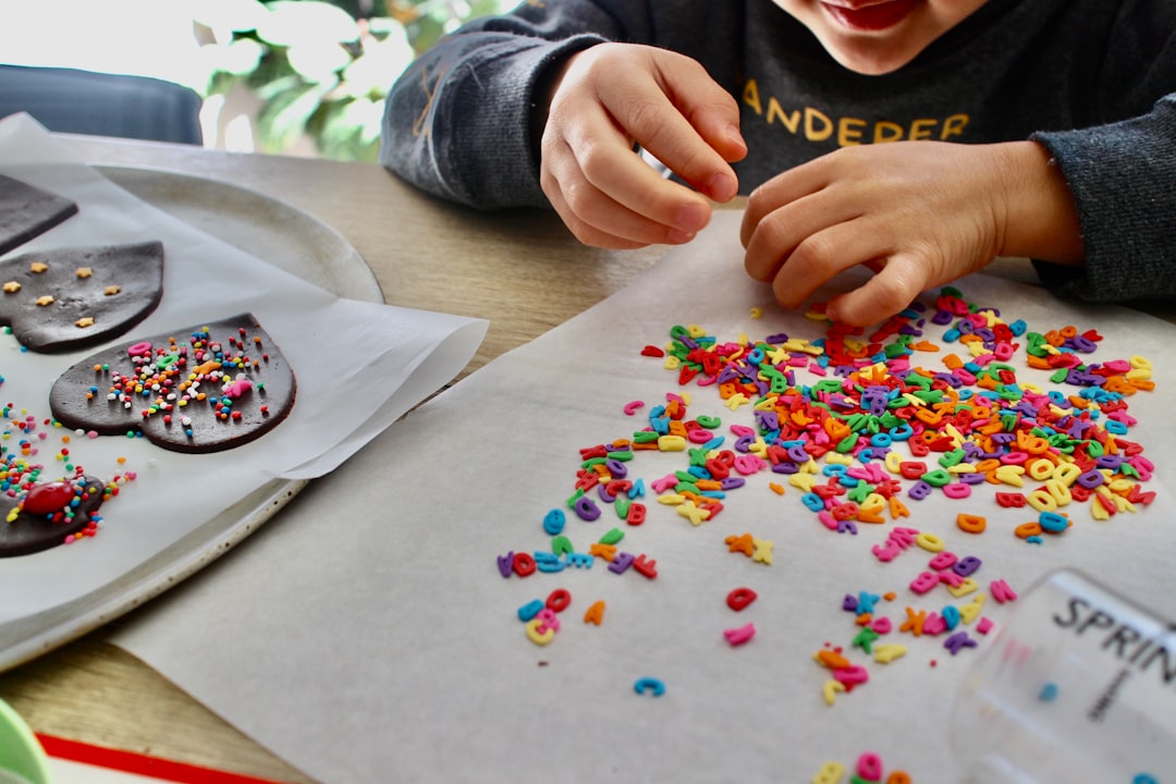 Child experimenting with colorful art materials