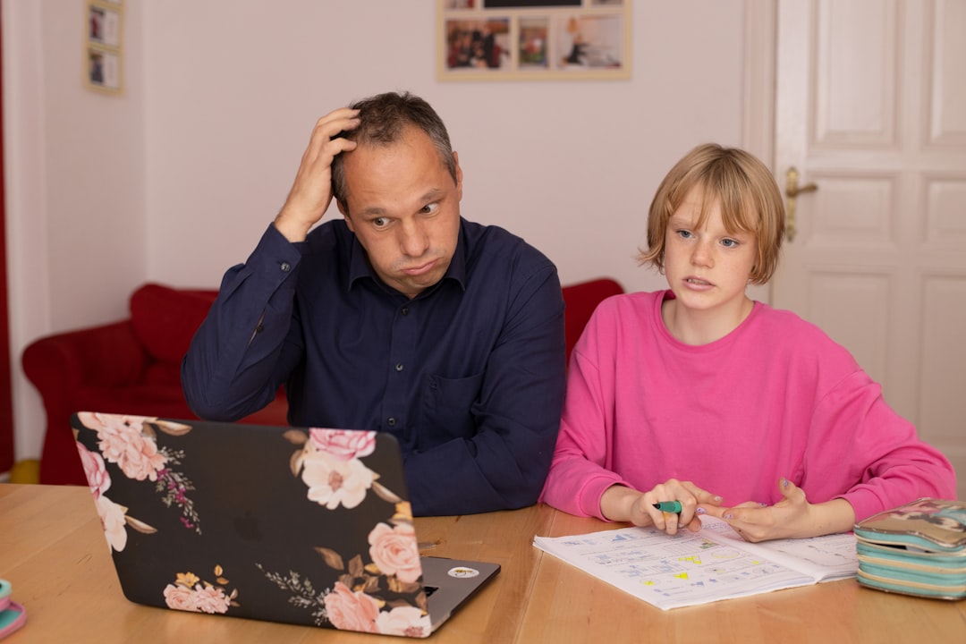A perplexed father during homeschooling with his daughter, illustrating how parental pressure can create confusion and resistance rather than motivation