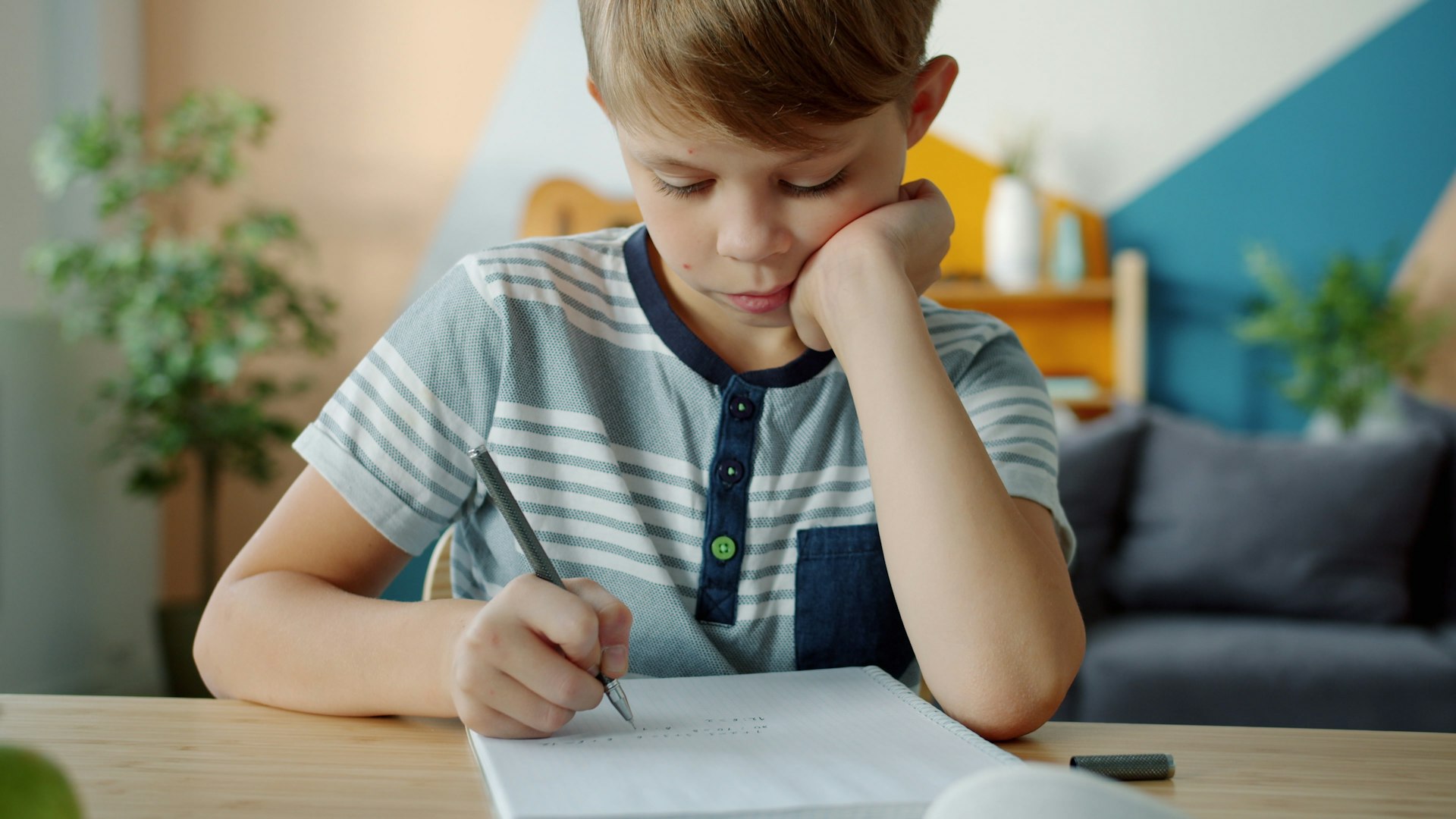 Young student focused on homework at a desk