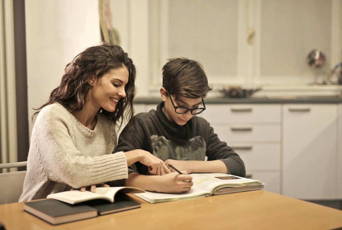 In-home tutoring session with books and notes